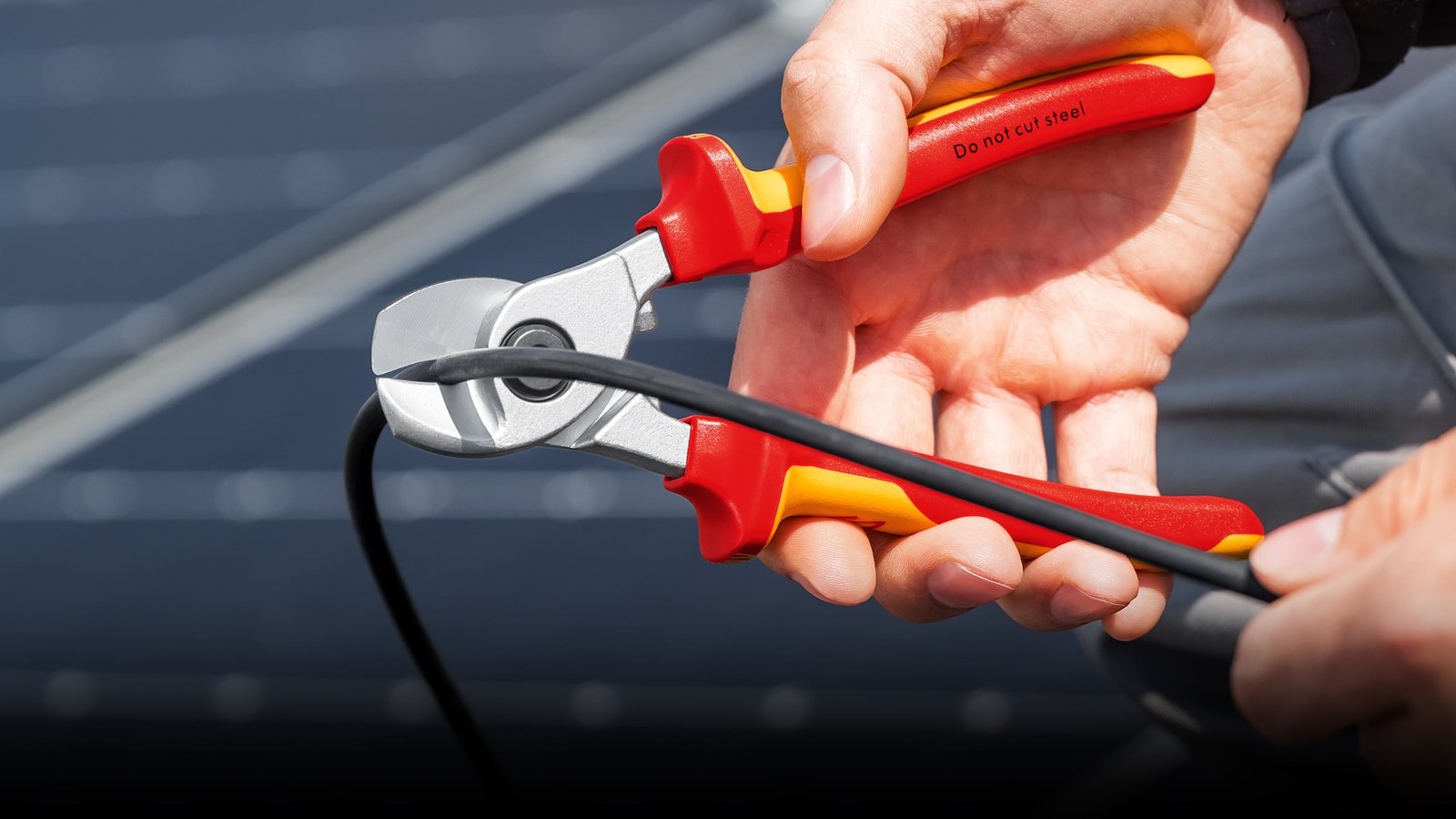 KNIPEX cable shears cutting a photovoltaic cable